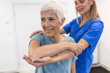 Professional therapists is stretching muscles, senior patient with abnormal muscular symptoms, physical rehabilitation therapies and treatment of physiological disorders by physiotherapists concept. - obrazy, fototapety, plakaty