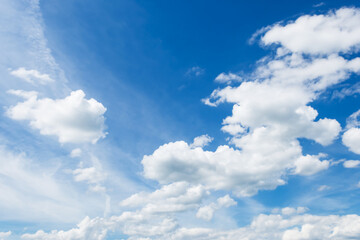 Naklejka na ściany i meble Cumulus clouds in blue sky, white fluffy clouds floating in blue sky, blue sky background with clouds