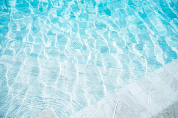 Transparent blue clear water surface texture in the pool. Abstract summer banner background Water...