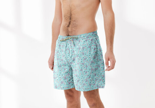 Mockup of man wearing customizable printed swim trunks