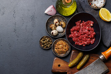 Cooking savory beef tartare and brown bread toasts