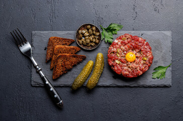 Savory beef tartare and brown bread toasts