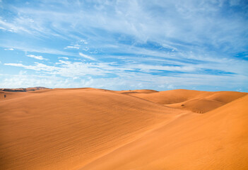 Fototapeta na wymiar A tranquil azure sky over an arid desert landscape.