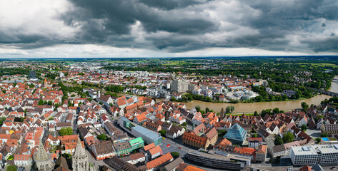 An aerial cityscape with crowded residential areas and city infrastructure.