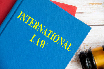 Top view of International Law book with gavel background. Law concept