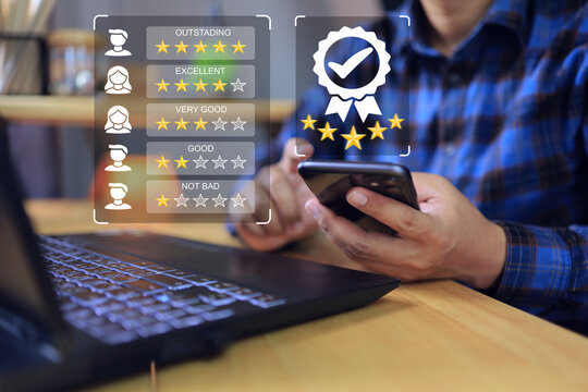 Businessman with smart phone feedback rating on outstanding to evaluating vendor or supplier industrial facility maximum five stars according to ISO documentation management system partner affiliate
