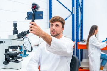Scientist recording a video using phone inside a research laboratory