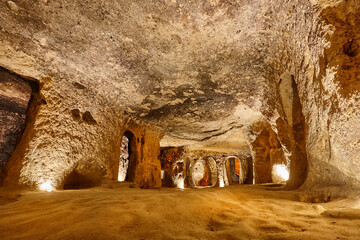 Food storage cave. Ancient underground city of Kaymakli. Cappadocia, Turkey - obrazy, fototapety, plakaty
