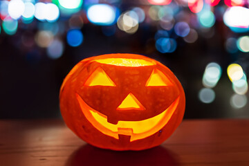pumpkin jack with colorful blinking led lights bokeh on background for halloween at night