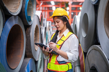 Portrait of women staff worker Standing counting and inspecting products in the metal sheet...