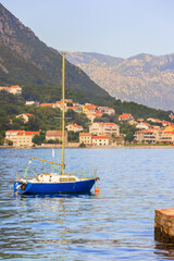 Kotor, Montenegro boat, town and mountains
