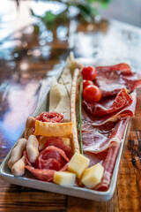 Iberian Feast: A Spanish Classic Combo of Jamón, Cheese, Tomatoes, and Crusty Bread. A medley of flavors capturing the essence of Spanish culinary excellence.