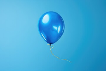 Blue And Gold Flying Balloon On Light Blue Background
