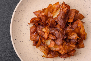 Delicious crispy potato chips with salt and spices