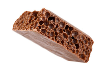 A cube of milk porous chocolate isolated on a transparent background.