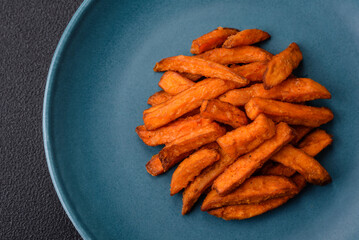 Delicious crispy sweet potato fries with salt, spices and herbs