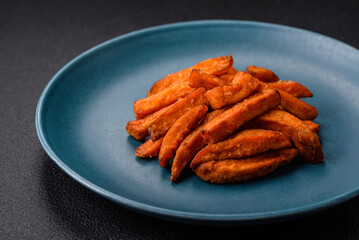 Delicious crispy sweet potato fries with salt, spices and herbs