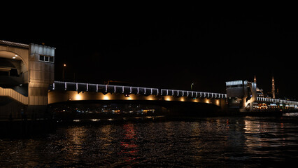 Fototapeta na wymiar View of Galata Bridge from the sea at night. Istanbul nightlife and entertainment venues. Night view of Istanbul. Turkey.