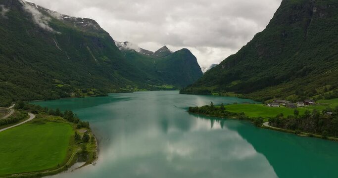Idyllic scenery of still turquoise water lake and mountainous landscape