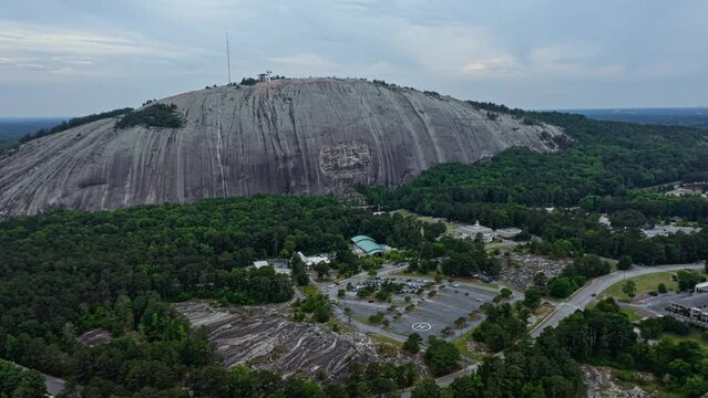 Aerial approaching shot of Granitic rock in Stone Mountain, Georgia, America