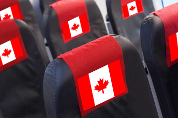 Empty seat in plane with Canadian Flag. Travel, flight and transportration in Canada concept