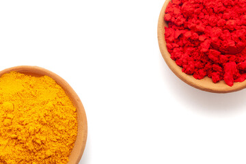 Top view of Earthen pot filled with Red sindoor and Turmeric (Haldi), isolated on white.