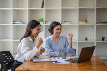Fototapeta premium Two business worker consult and plan together. Brainstorm, share, and discuss business project ideas.