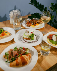 Healthy breakfast with avocado, poached egg, soft cheese and sprouts. Healthy diet food.