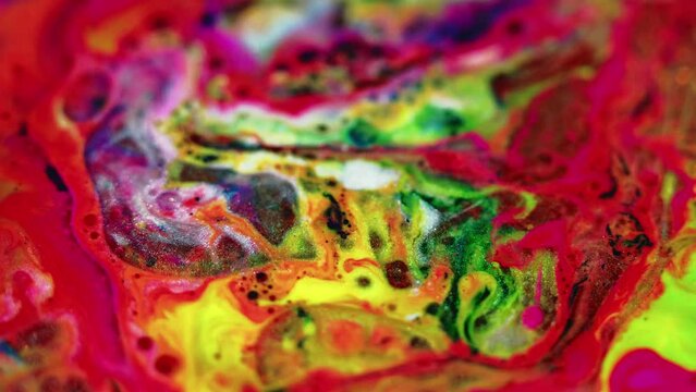 Glitter paint mix. Ink water bubbles. Blur bright red yellow green white color sparkling marble texture oil fluid blend flow abstract art background.