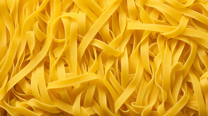 Top view photo of raw yellow pasta noodles. Food background