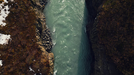 Aerial view of icelandic waterfall in river canyon, spectacular nordic scenery with water stream...