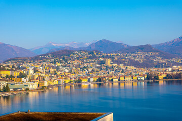 Cityscape over Lugano with Mountain and Lake Lugano in a Sunny Day in Ticino, Switzerland.
