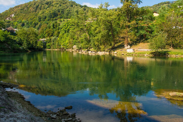 Fototapeta na wymiar Vrucica Hot Springs on the Vrbas River as it flows through Srpske Toplice south east of Banja Luka in Republika Srpska, Bosnia and Herzegovina