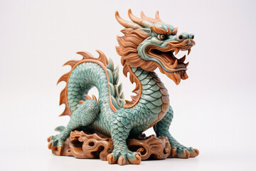 Obraz premium Ceramic dragon statuette symbolising prosperity in Lunar New Year isolated on a white background 