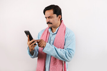 portrait of disappointed, sad Indian farmer man in rural India concept. white background. Cheerful...
