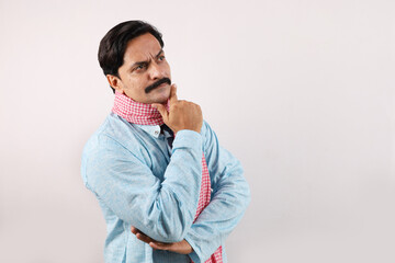 Happy rural Indian farmer standing in the white background, the passionate farmer full of enthusiasm shows sense of achievement and accomplishments