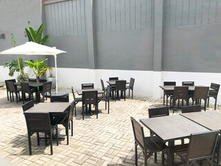 Modern architecture - fashionable outdoor cafe or restaurant tables