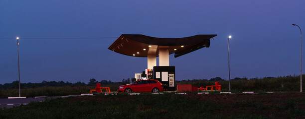 Modern self service gas station at night