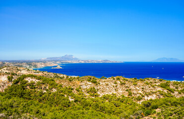 View of the landscape and the Mediterranean Sea from a mountain on the Greek island of Kos.	