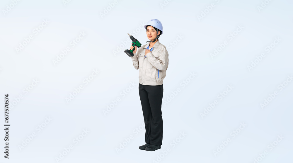 Poster 電動ドライバーを持ったヘルメットと作業服を着た女性　作業員　エンジニア　切り抜き全身写真（切り抜き背景透過pngも販売しております。作成者リンクから「png」で検索してください）