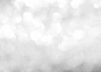 Silver glitter blur background of bright sparkling white light glittering bokeh chandelier illumination for winter Christmas holiday decoration backdrop - obrazy, fototapety, plakaty