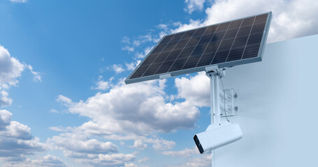 Autonomous surveillance camera with solar panel  on a background of blue sky. Perimeter security - obrazy, fototapety, plakaty
