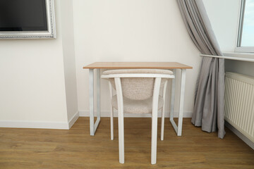 A beautiful chair and table in a modern apartment