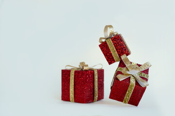 Christmas Gifts in Red Boxes with Gold Ribbons