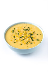 Corn soup in green bowl isolated on white background