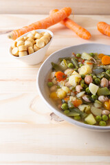 Vegetable and legume minestrone served with croutons. Complete vegan dish ideal for lunch and dinner. Italian minestrone.