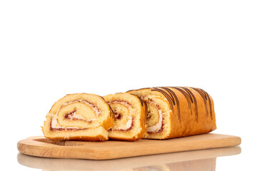One delicious cherry roll cut into slices on a bamboo kitchen board, macro, isolated on white background.