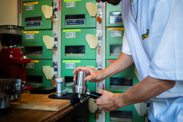 Japanese barista giving a class about how to make coffee