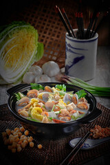 traditional chinese healthy braised puritan noodle with clam prawn seafood thick soup in bowl on grey vintage background cafe hotel luxury halal food restaurant banquet menu