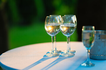 Champagne glasses on the buffet table. Table setting for a buffet at a party. 